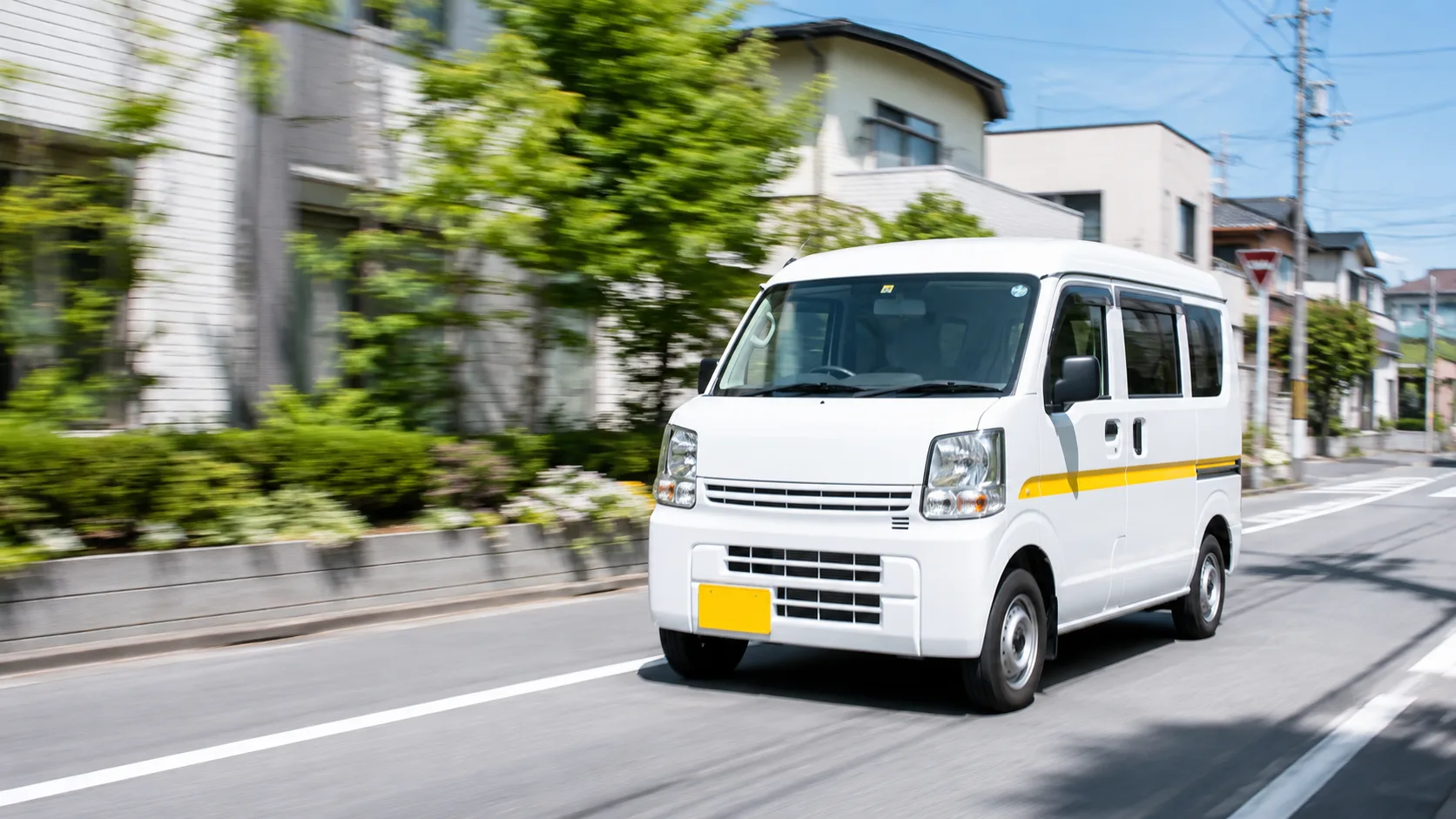 明石エリアの配送ルートを走行する軽貨物車両